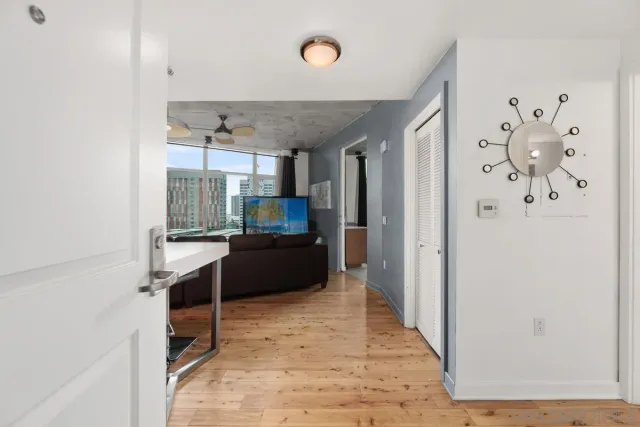 a kitchen with stainless steel appliances kitchen island granite countertop a refrigerator and a sink