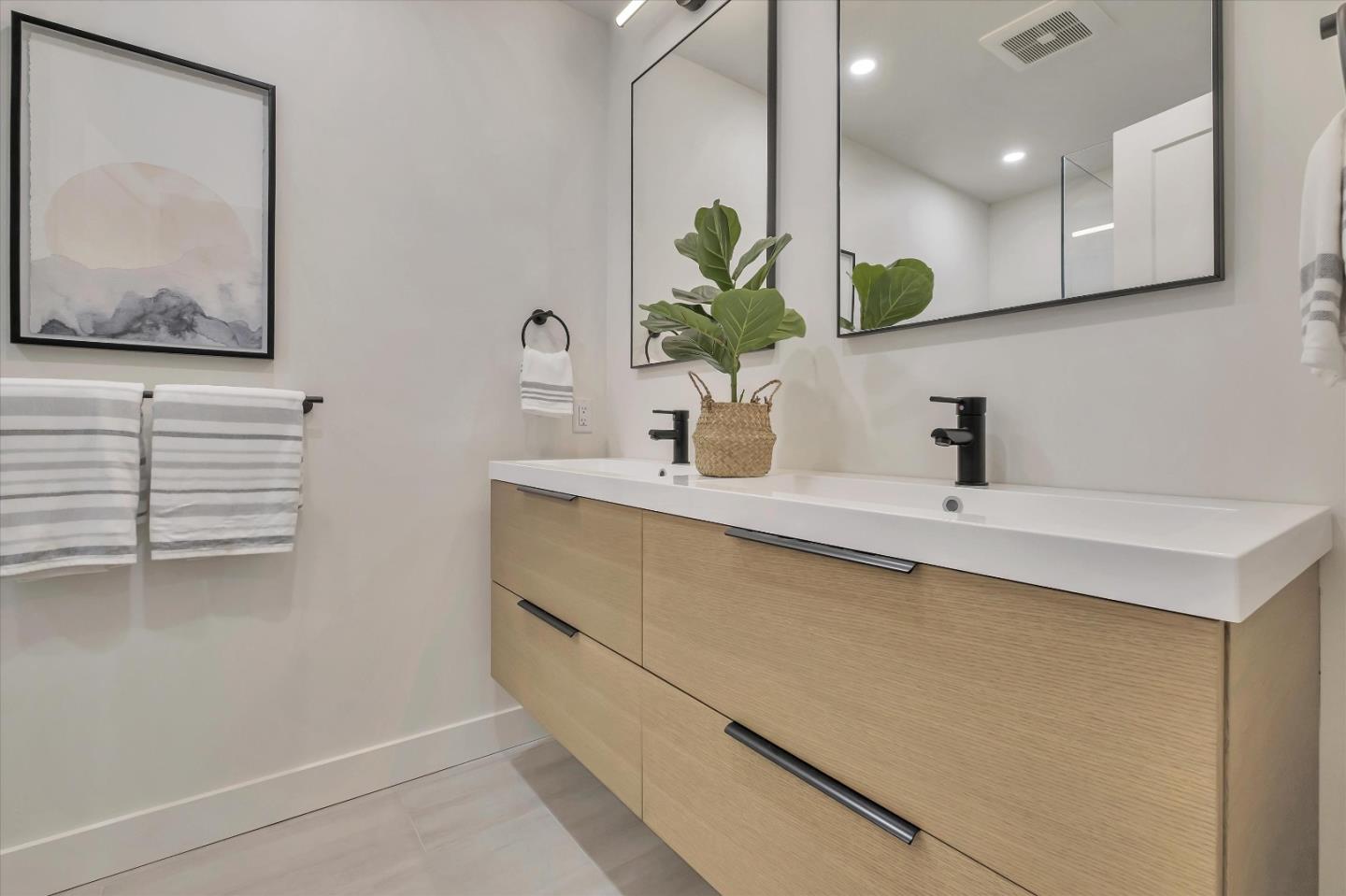 129 Darlington Soquel, CA 95073 - Photo 12 of 27 a bathroom with a sink a potted plant and a window