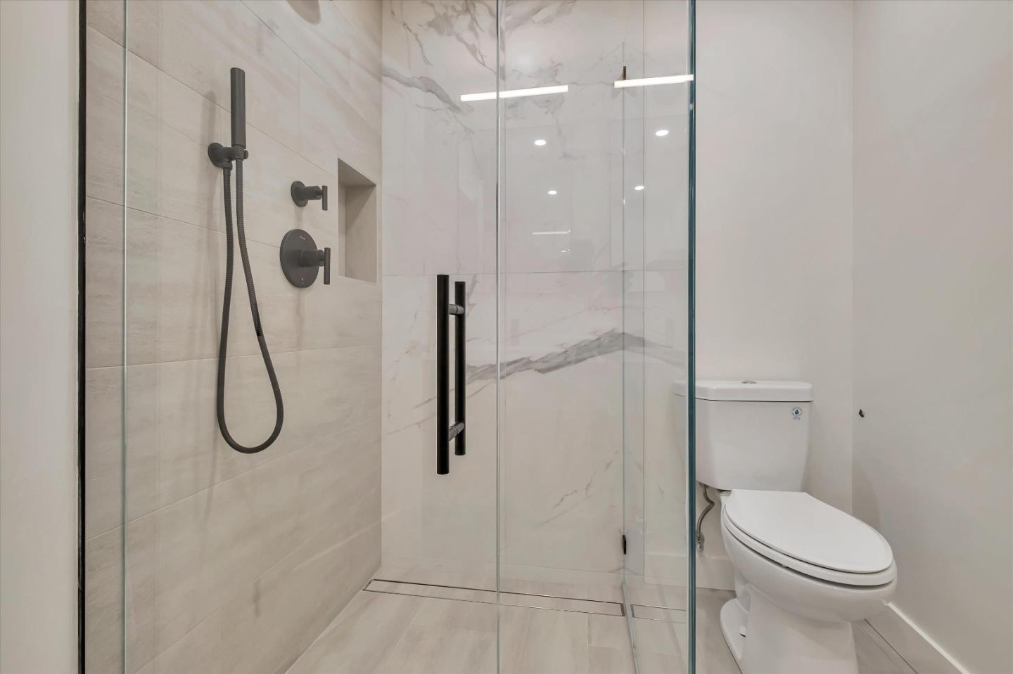 129 Darlington Soquel, CA 95073 - Photo 13 of 27 a bathroom with a granite countertop shower a toilet and sink