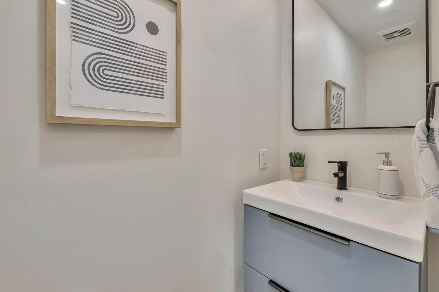 129 Darlington Soquel, CA 95073 - Photo 14 of 27 a bathroom with a sink and a mirror