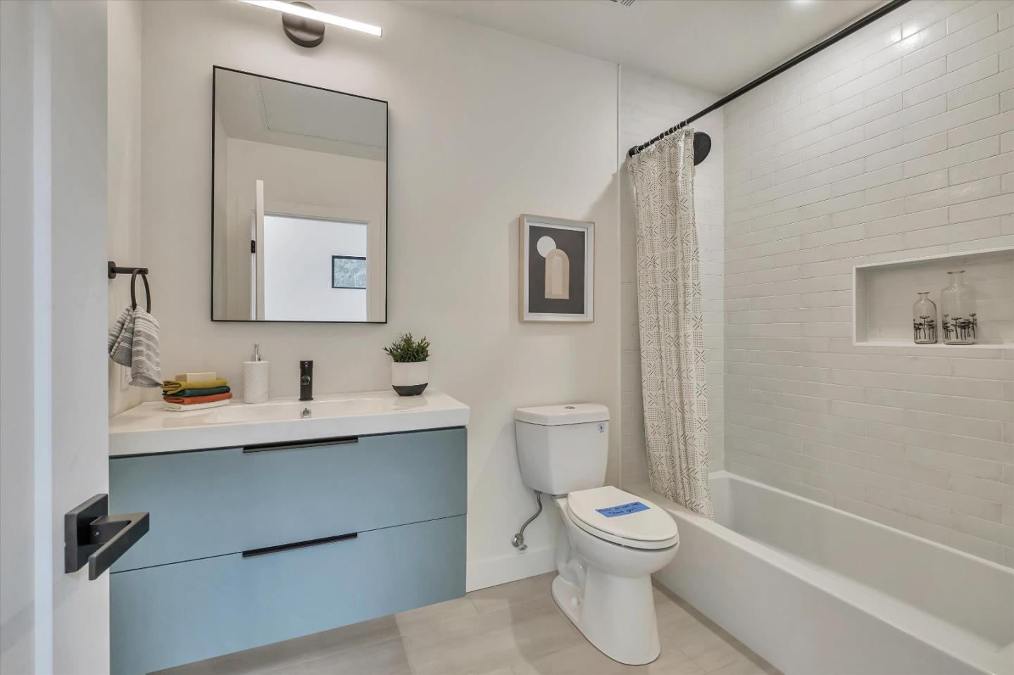 129 Darlington Soquel, CA 95073 - Photo 15 of 27 a bathroom with a toilet a sink and a mirror