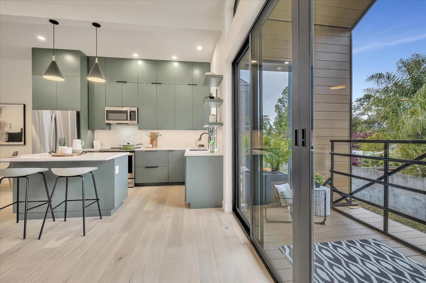 129 Darlington Soquel, CA 95073 - Photo 25 of 27 a kitchen with kitchen island a counter top space a sink stainless steel appliances and cabinets
