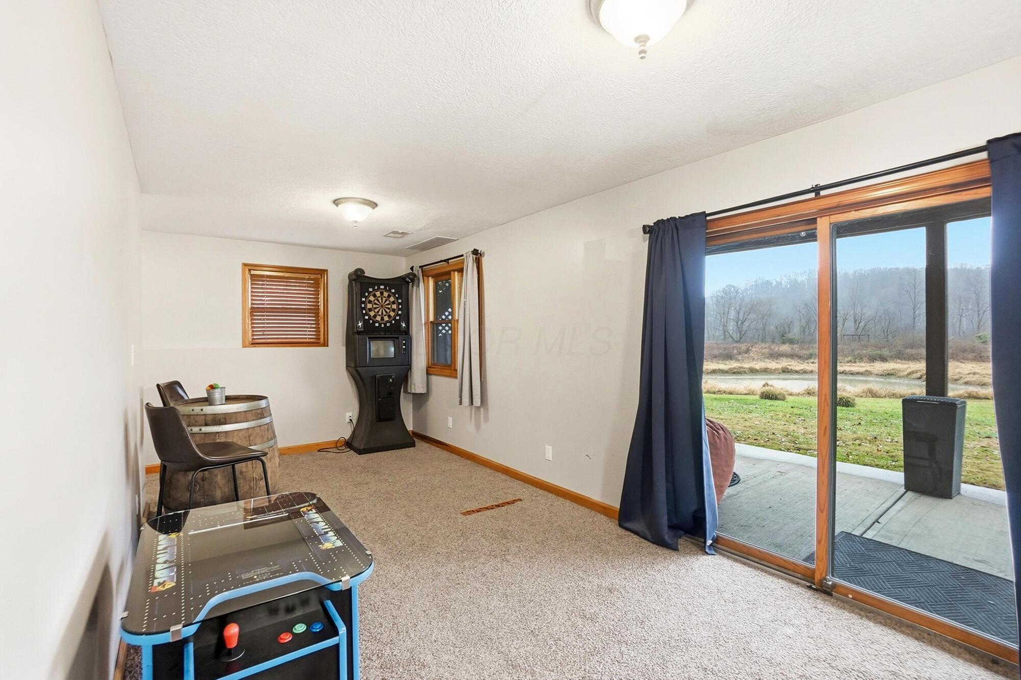 6321 R K Miller Road Logan, OH 43138 - Photo 52 of 90 The Arcade Game area on Lower Level