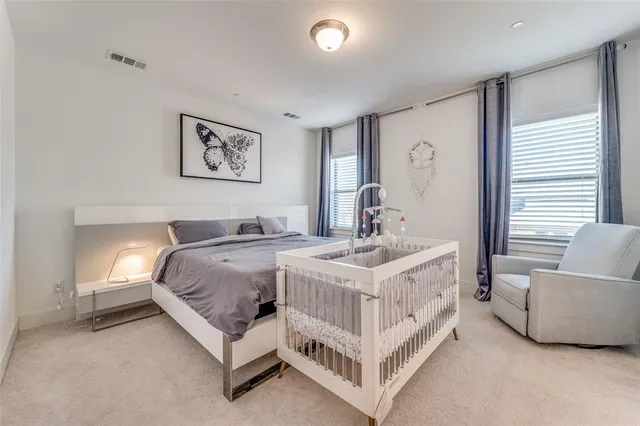 a spacious bedroom with a bed and a couch