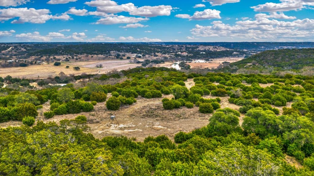 235 Merrill Lane Ingram, TX 78025 - Photo 18 of 20 a view of a lake with a city
