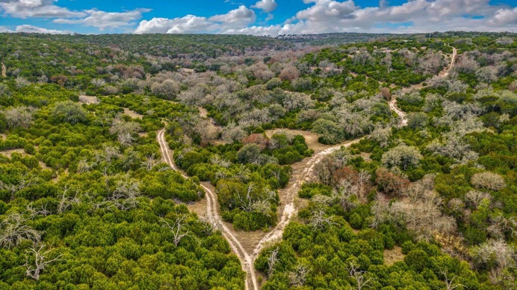 235 Merrill Lane Ingram, TX 78025 - Photo 2 of 20 a view of a field of a building