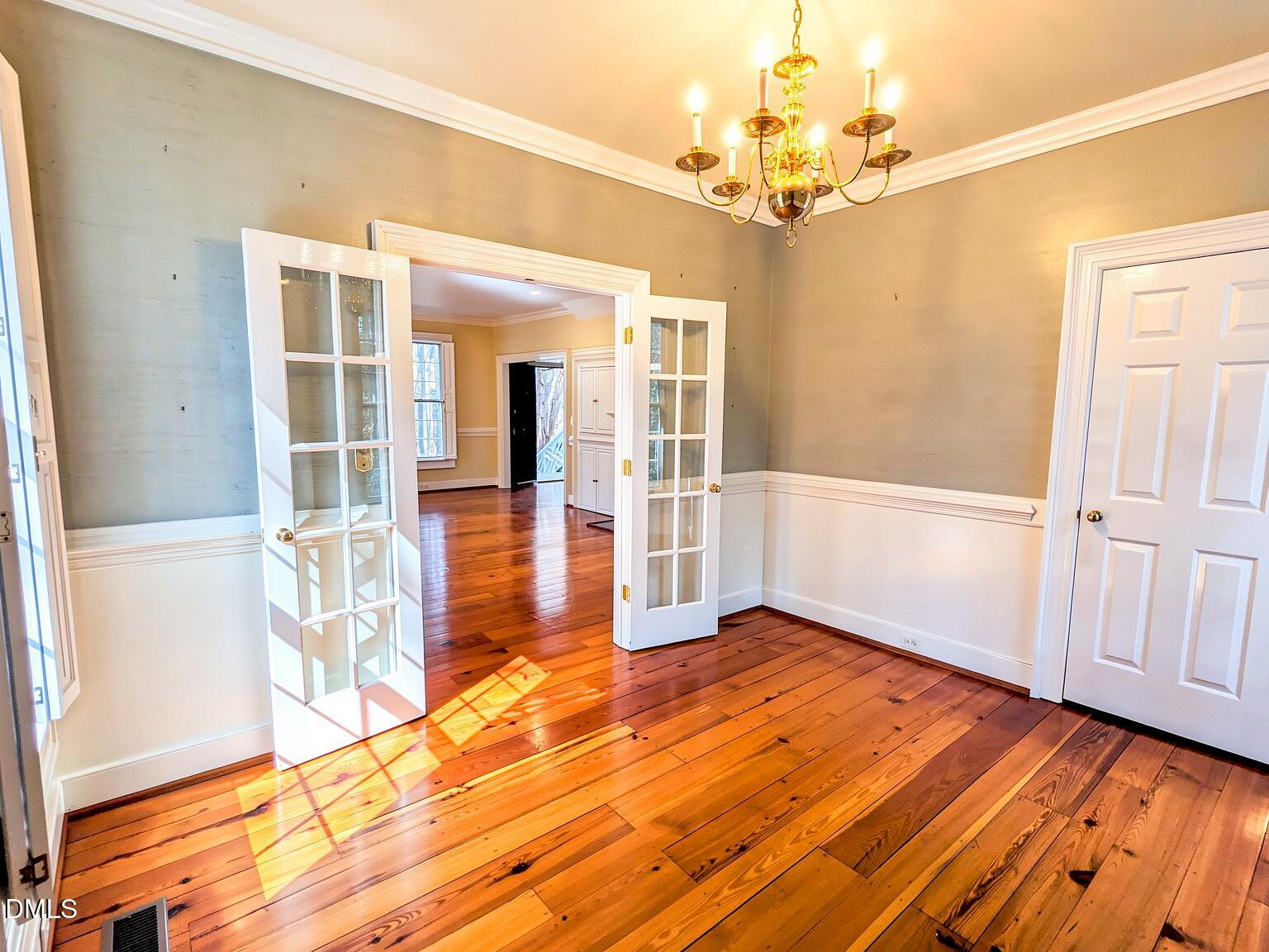 4901 Stoneridge Drive Raleigh, NC 27612 - Photo 36 of 50 wooden floor in an empty room with a window