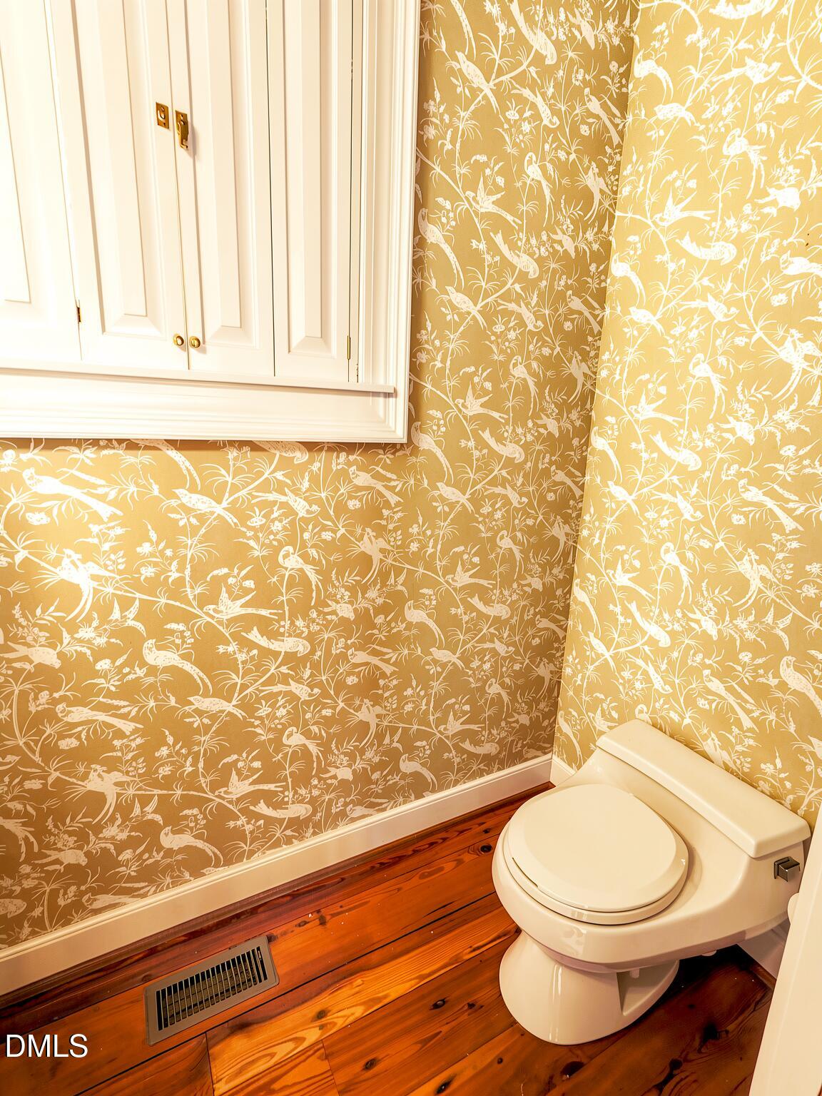 4901 Stoneridge Drive Raleigh, NC 27612 - Photo 39 of 50 a bathroom with a toilet and a sink