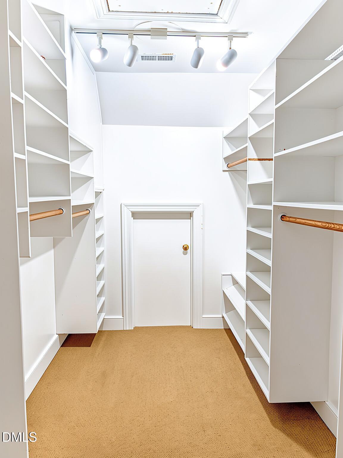 4901 Stoneridge Drive Raleigh, NC 27612 - Photo 42 of 50 a view of walk in closet with empty racks