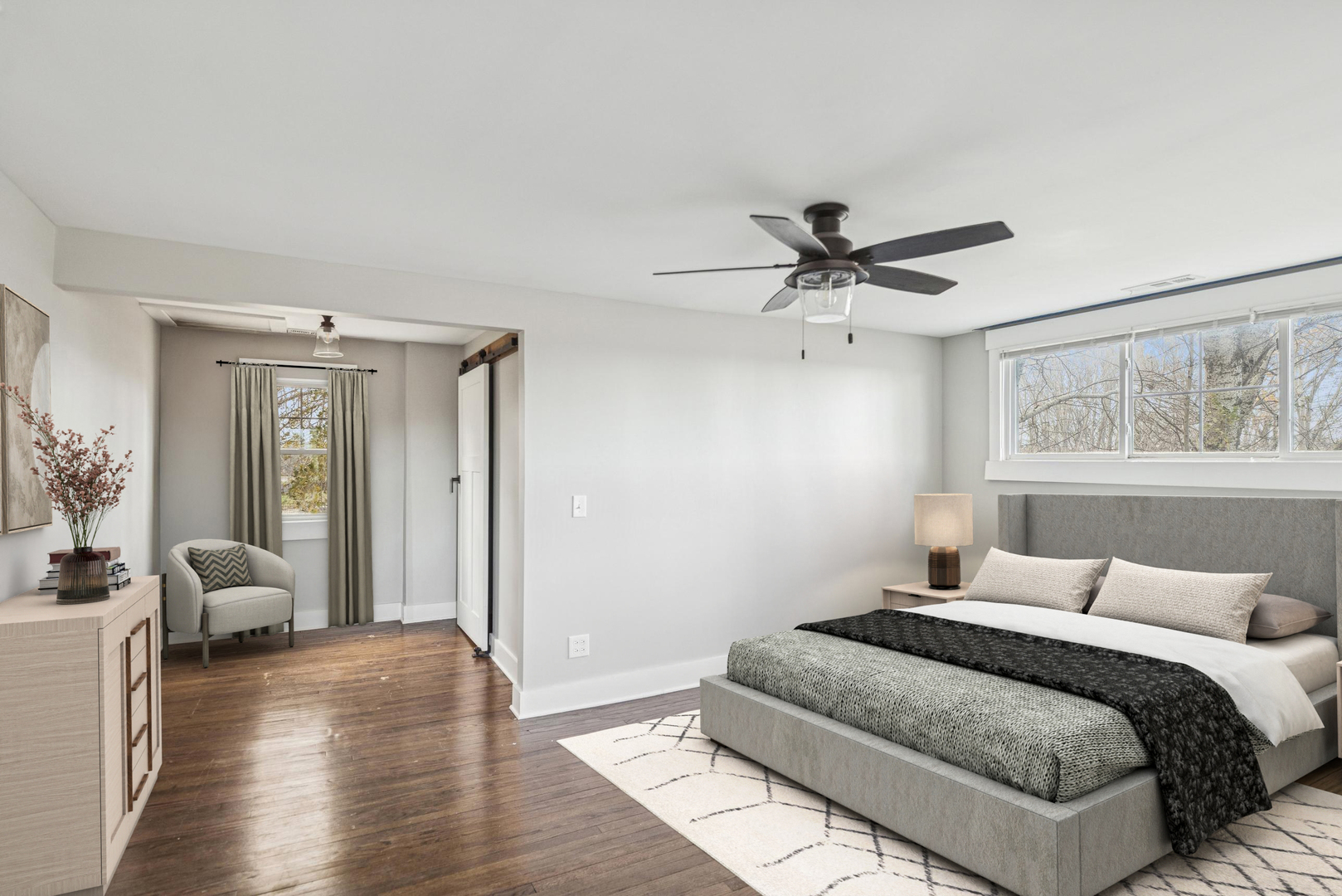 580 North Cedar Lake Road Lake Villa, IL 60046 - Photo 15 of 44 a bedroom with a large bed chandelier and a window