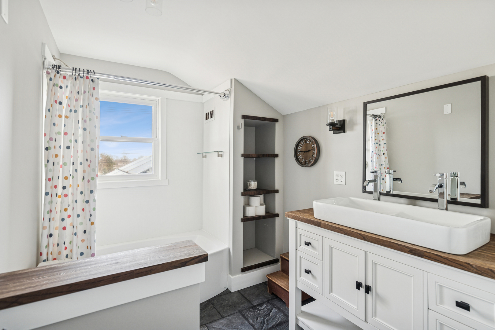 580 North Cedar Lake Road Lake Villa, IL 60046 - Photo 17 of 44 a bathroom with a sink a mirror and a shower