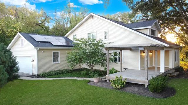 a view of a house with garden and yard