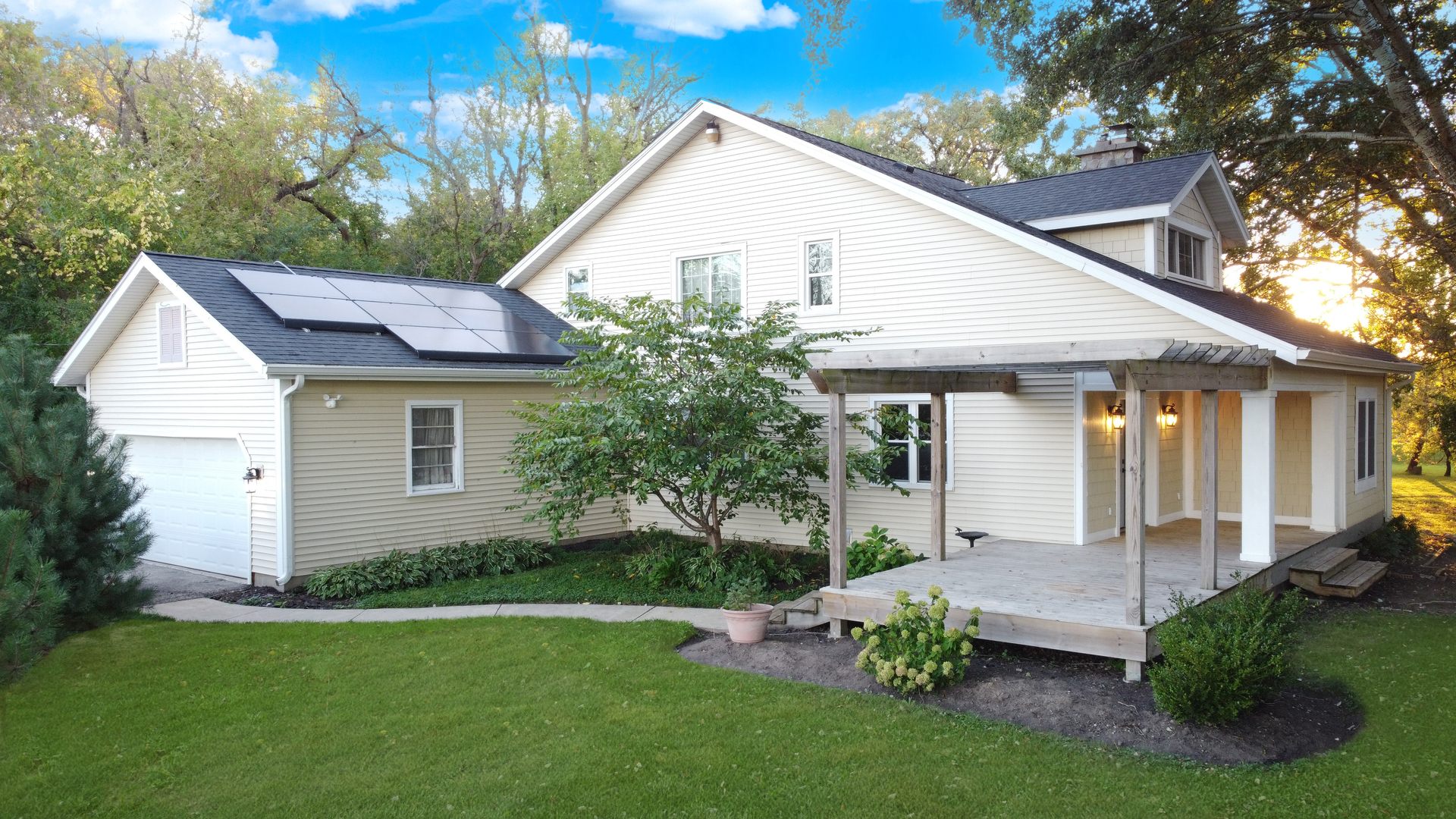 580 North Cedar Lake Road Lake Villa, IL 60046 - Photo 2 of 44 a view of a house with garden and yard