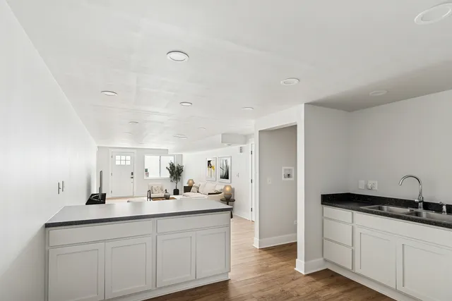a bathroom with a double vanity sink and mirror