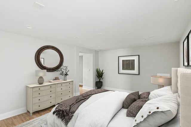 a bedroom with a bed and a dresser