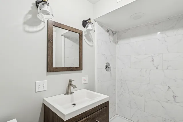 a view of a room with wooden floor and furniture