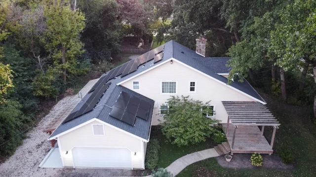 a front view of house with a garden
