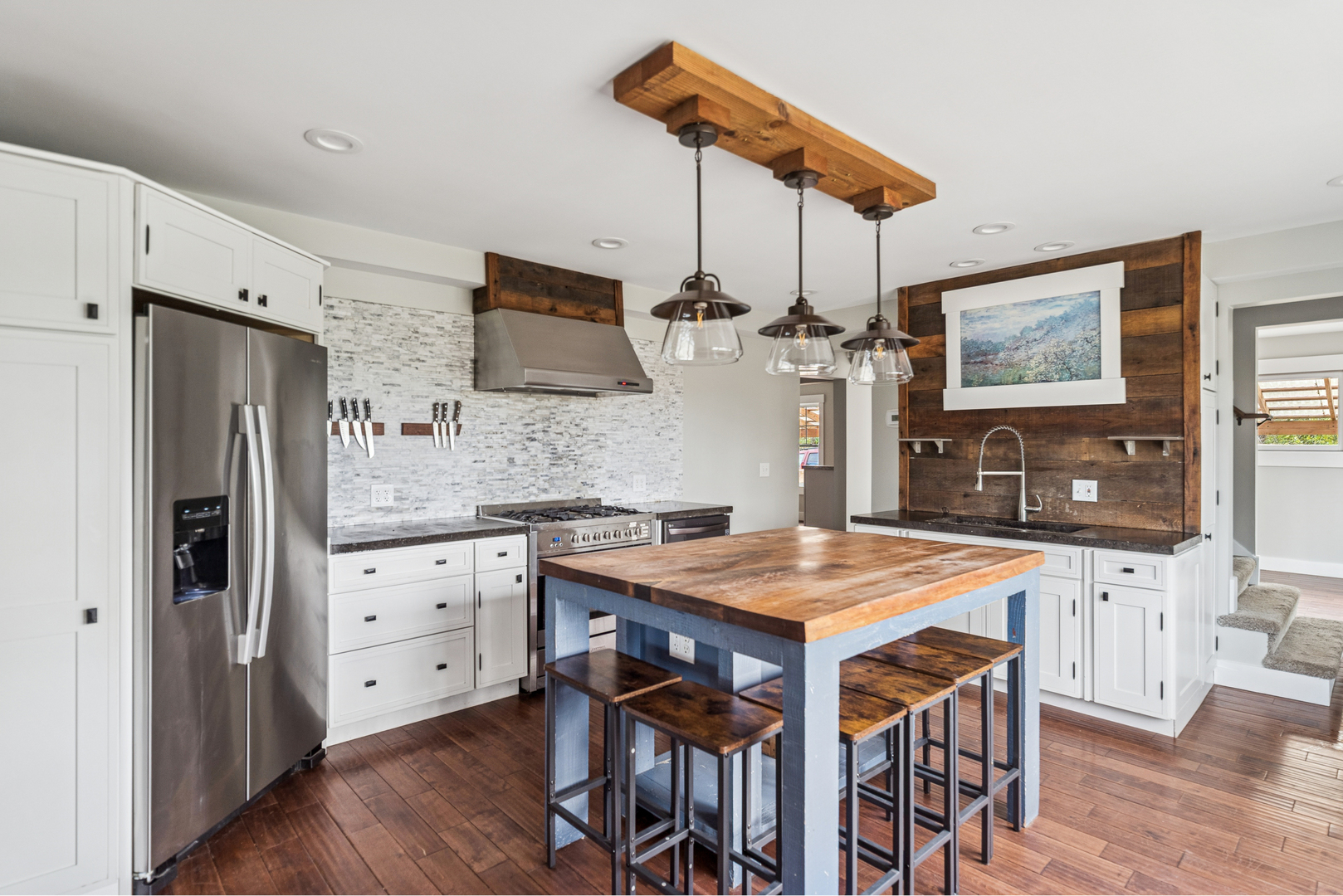 580 North Cedar Lake Road Lake Villa, IL 60046 - Photo 7 of 44 a kitchen with stainless steel appliances granite countertop a kitchen island a stove a table and chairs