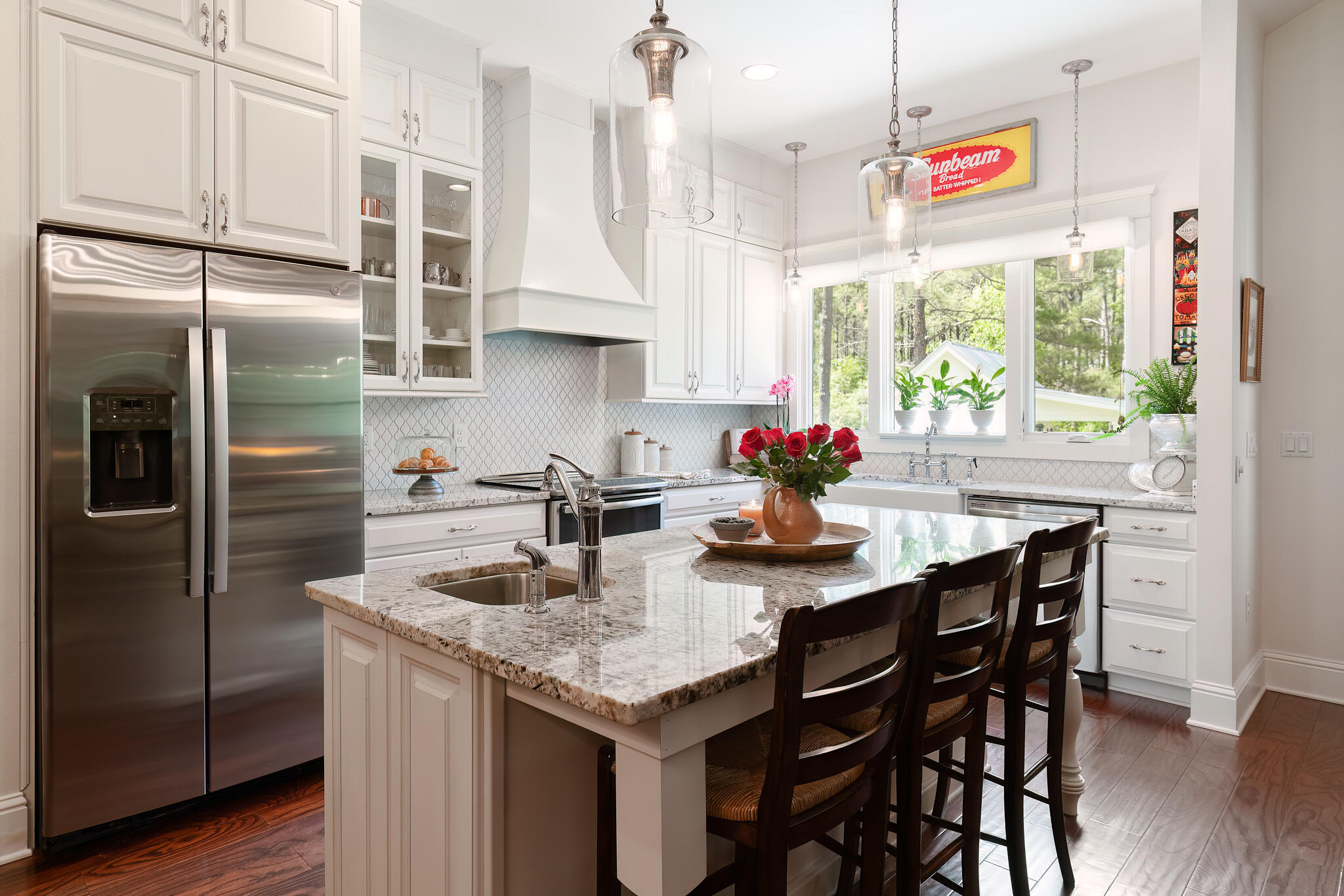 4351 Poverty Creek Road Crestview, FL 32539 - Photo 11 of 53 a kitchen with granite countertop stainless steel appliances a center island and a refrigerator