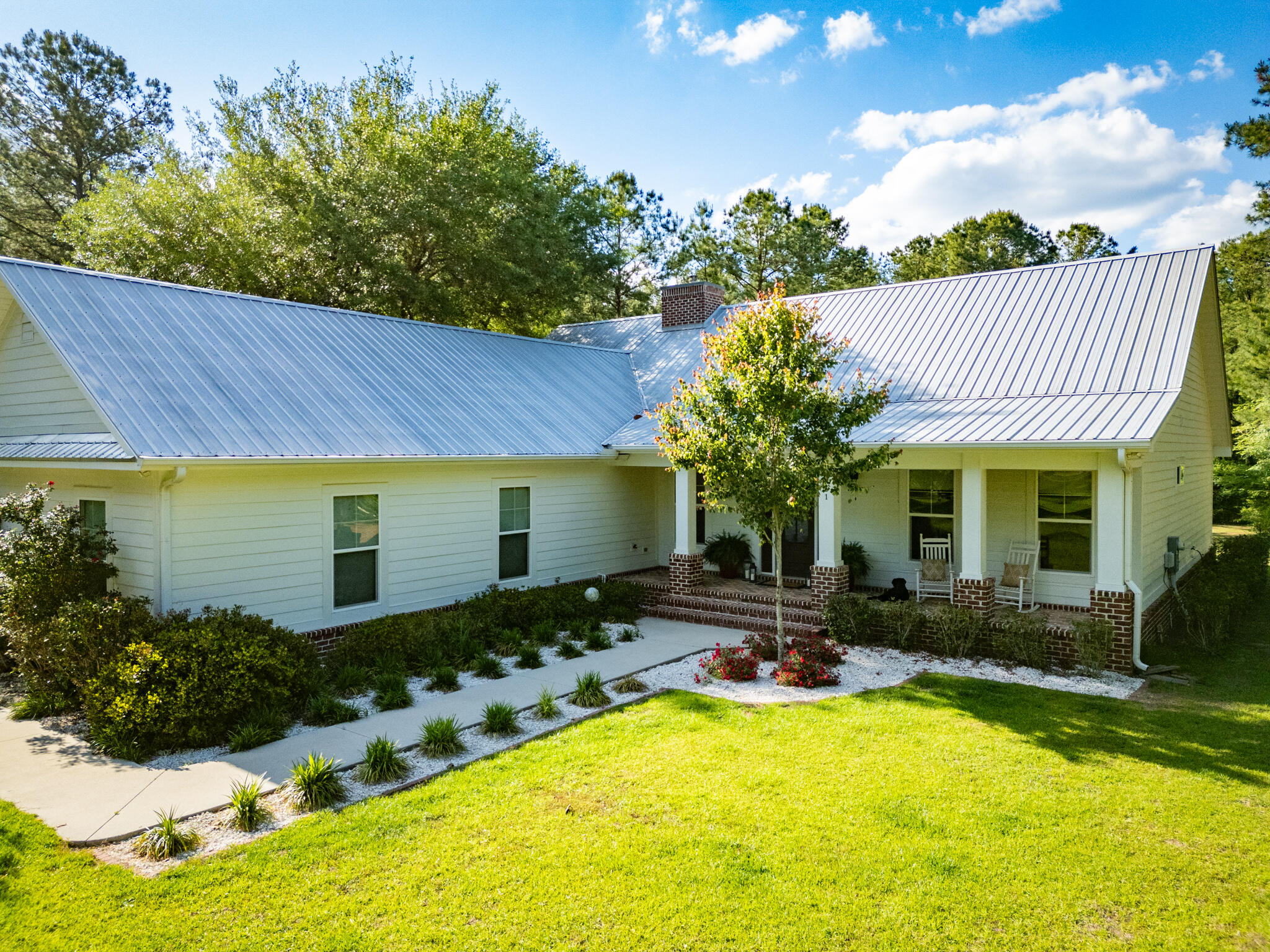 4351 Poverty Creek Road Crestview, FL 32539 - Photo 2 of 53 a house view with swimming pool and garden space