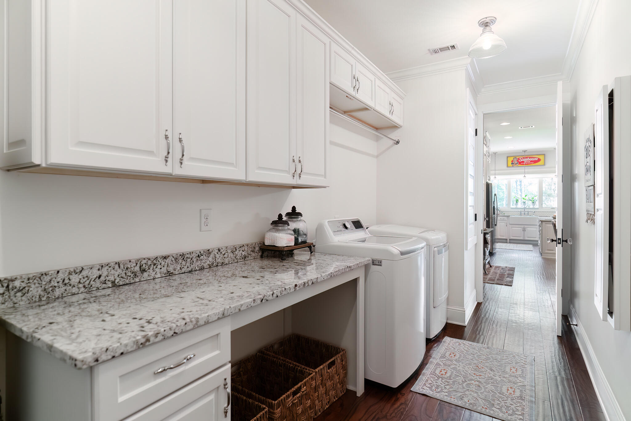4351 Poverty Creek Road Crestview, FL 32539 - Photo 31 of 53 a kitchen with granite countertop a sink stainless steel appliances white cabinets and a counter top space
