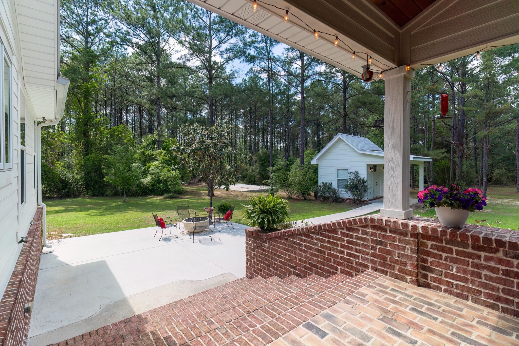 4351 Poverty Creek Road Crestview, FL 32539 - Photo 36 of 53 a view of a house with backyard and a sitting area