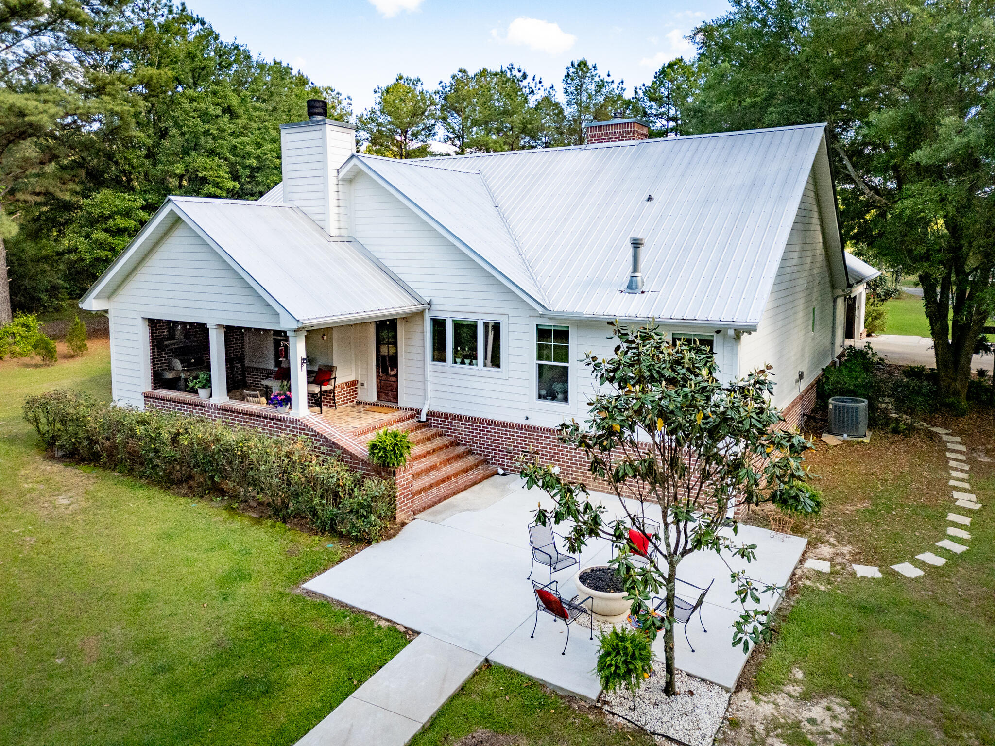 4351 Poverty Creek Road Crestview, FL 32539 - Photo 40 of 53 a front view of a house with garden