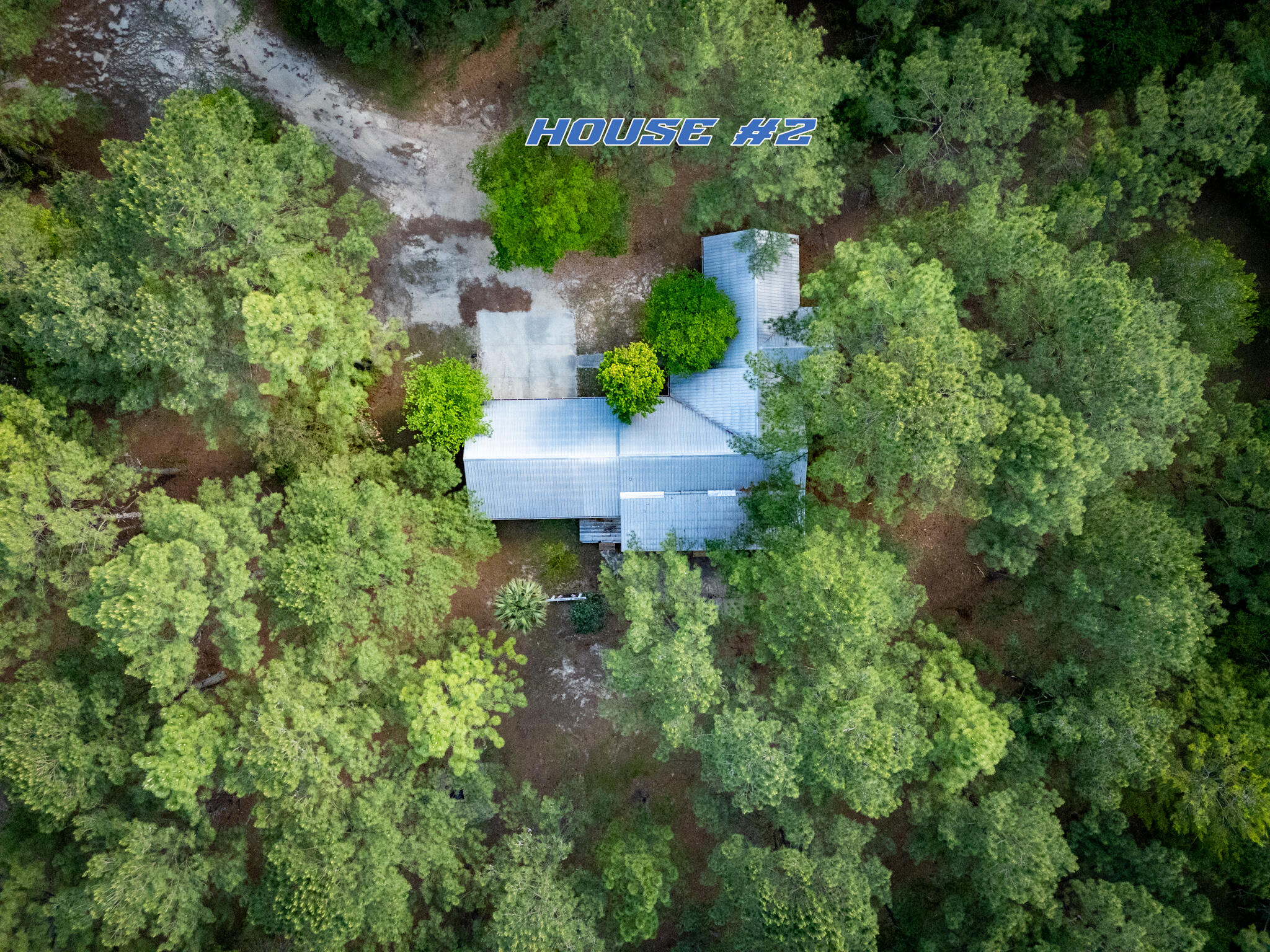 4351 Poverty Creek Road Crestview, FL 32539 - Photo 49 of 53 an aerial view of a house with a yard lake and outdoor seating