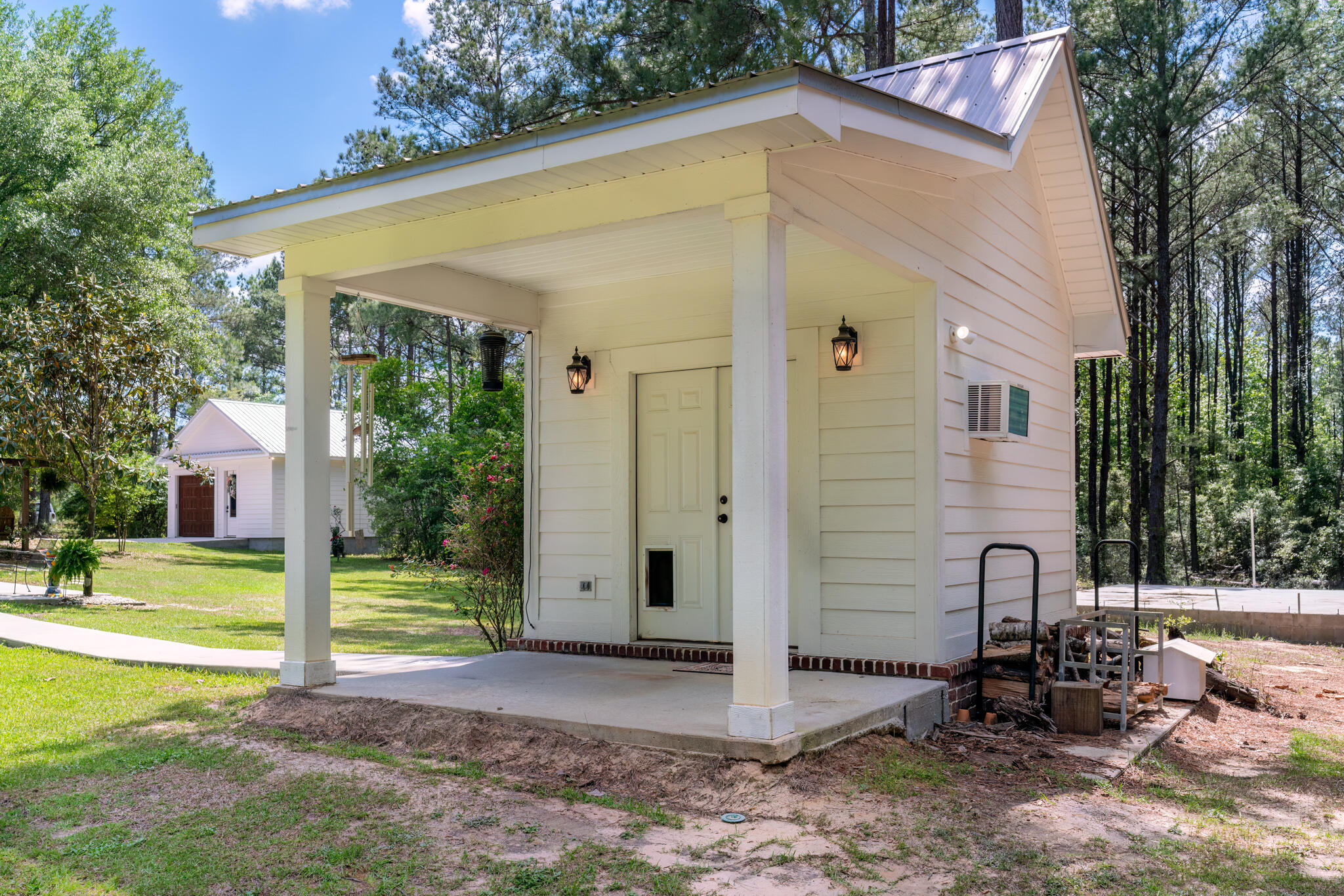 4351 Poverty Creek Road Crestview, FL 32539 - Photo 7 of 53 a front view of a house with garden