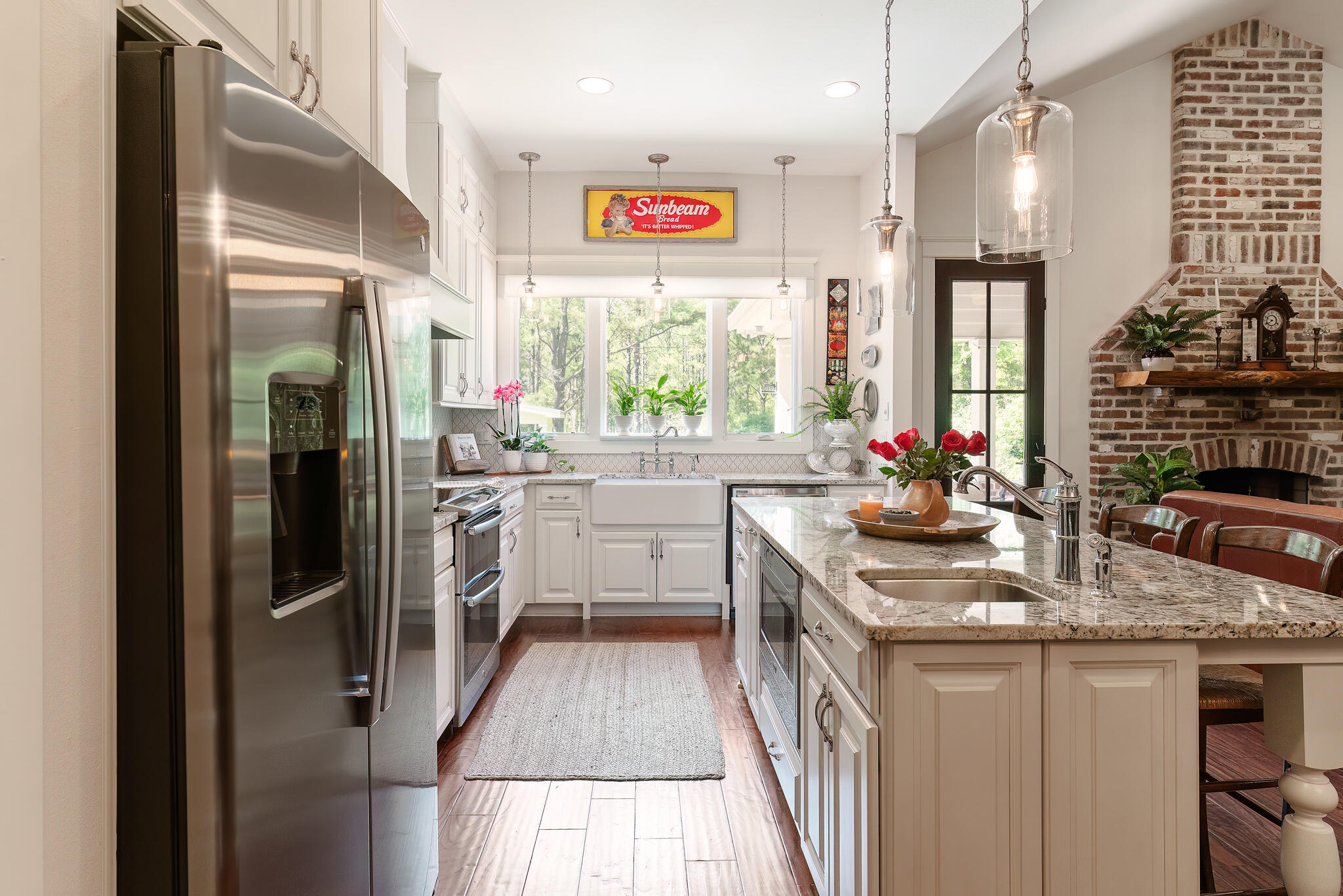 4351 Poverty Creek Road Crestview, FL 32539 - Photo 10 of 53 a kitchen with stainless steel appliances granite countertop a refrigerator a oven a sink dishwasher and a stove with wooden floor