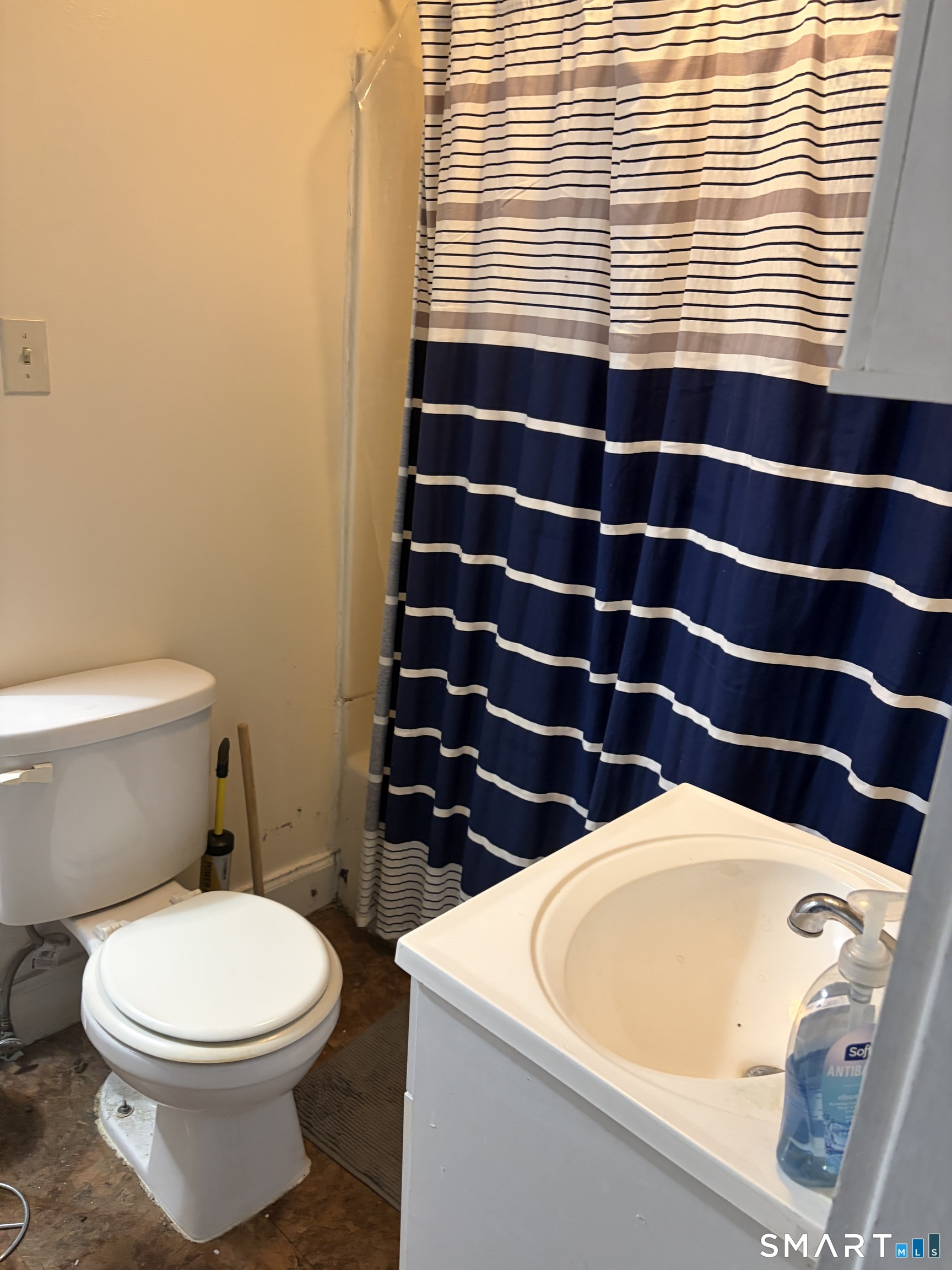 1079 Main Street Coventry, CT 06238 - Photo 18 of 19 a bathroom with a sink a toilet and a mirror