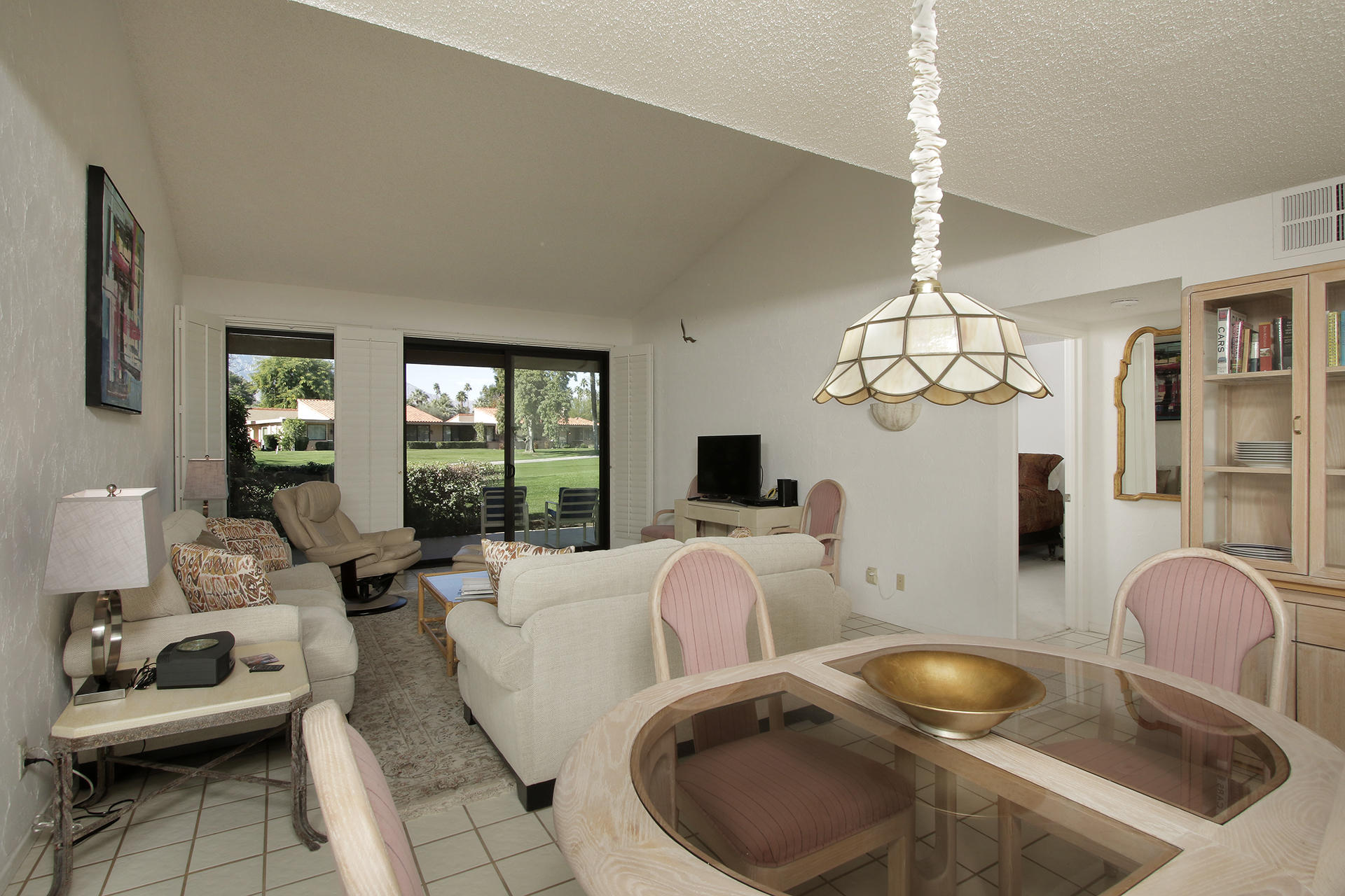 6 Cadiz Drive Rancho Mirage, CA 92270 - Photo 16 of 27 a living room with furniture chandelier and couch