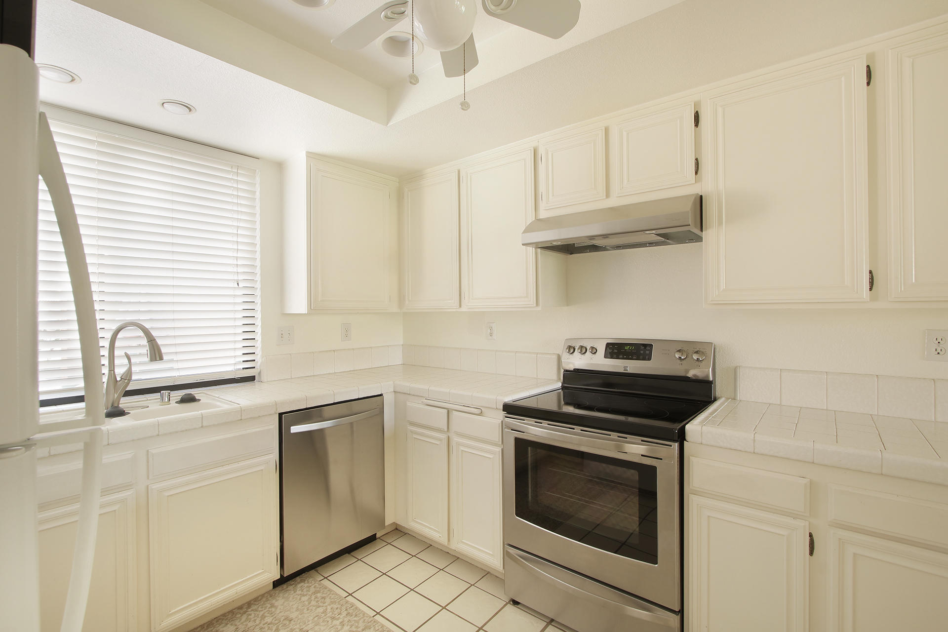 6 Cadiz Drive Rancho Mirage, CA 92270 - Photo 17 of 27 a kitchen with white cabinets and appliances