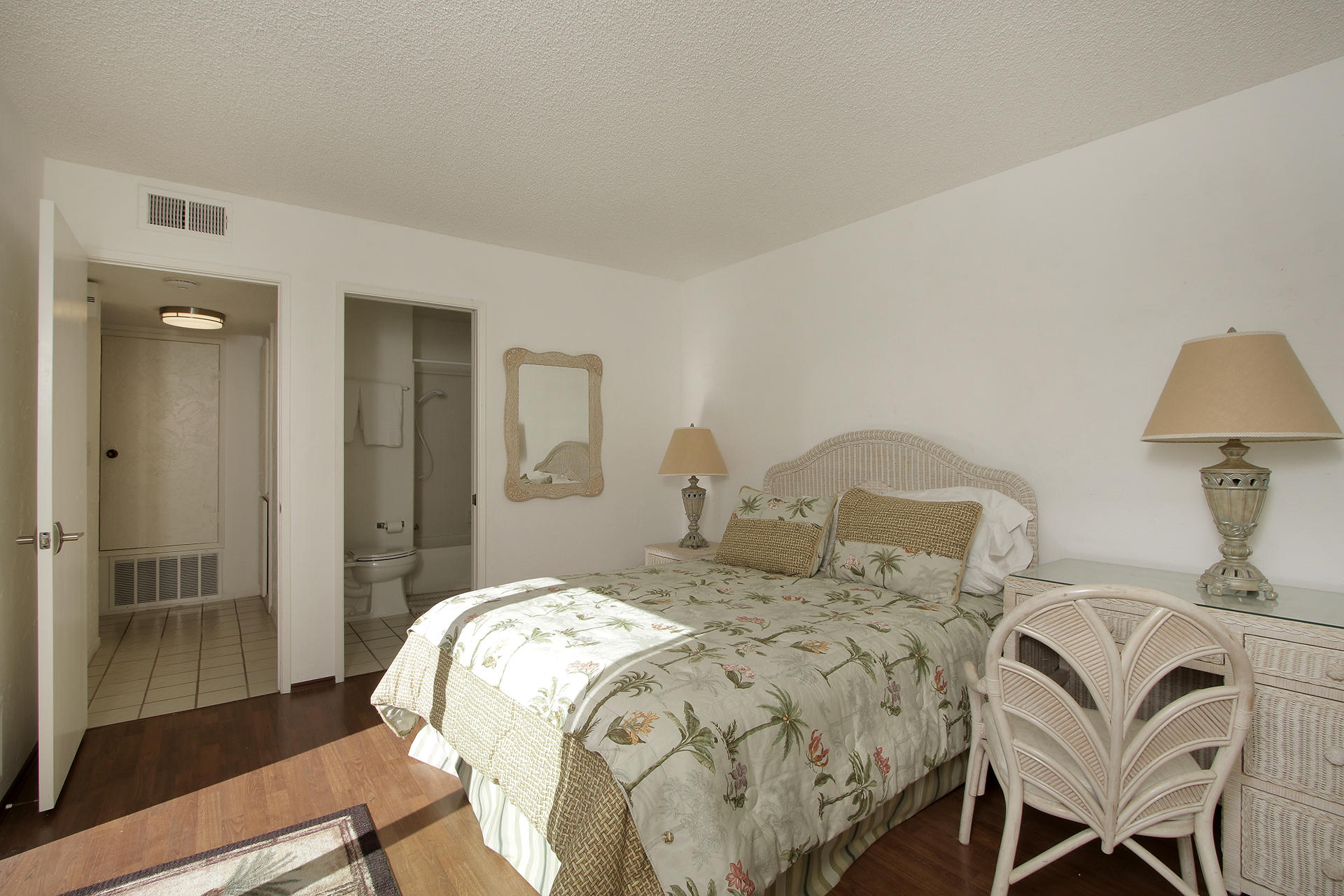 6 Cadiz Drive Rancho Mirage, CA 92270 - Photo 22 of 27 a bedroom with a bed and wooden floor