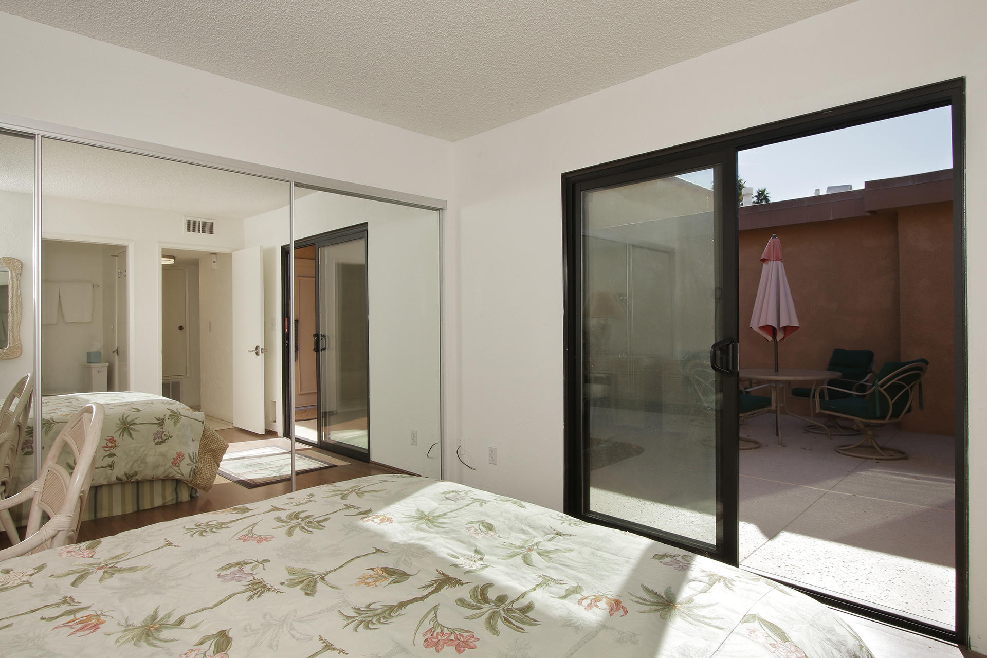 6 Cadiz Drive Rancho Mirage, CA 92270 - Photo 23 of 27 a bedroom with a bed and a mirror