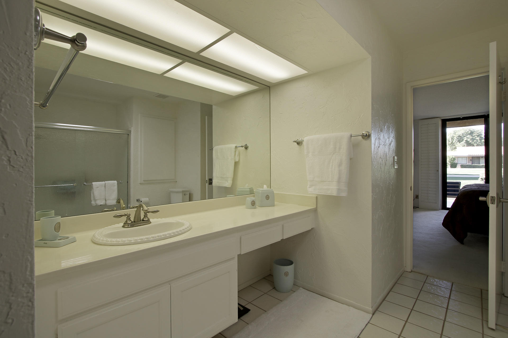 6 Cadiz Drive Rancho Mirage, CA 92270 - Photo 24 of 27 a bathroom with a sink double vanity and a mirror