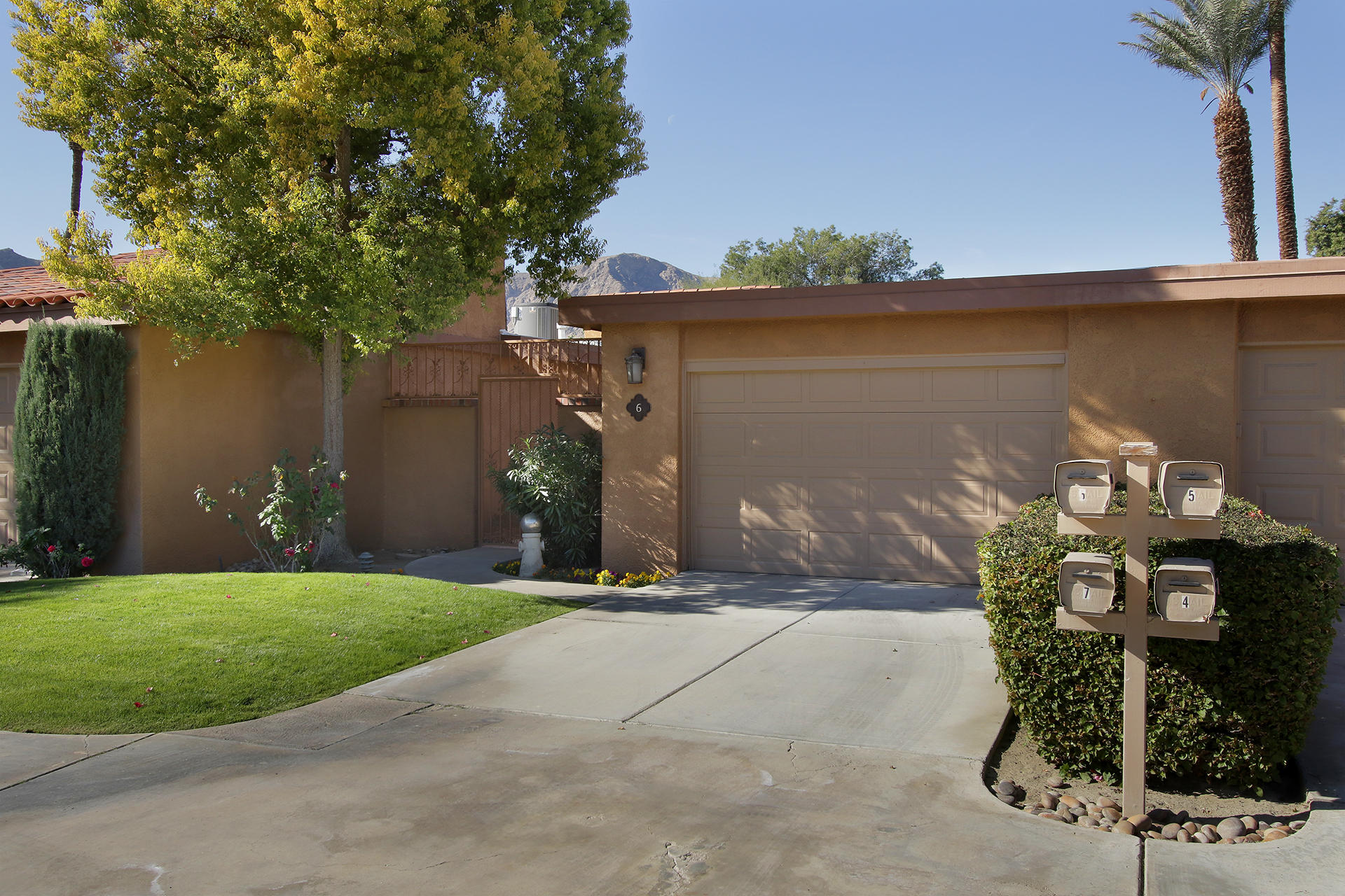 6 Cadiz Drive Rancho Mirage, CA 92270 - Photo 3 of 27 a front view of a house with garden