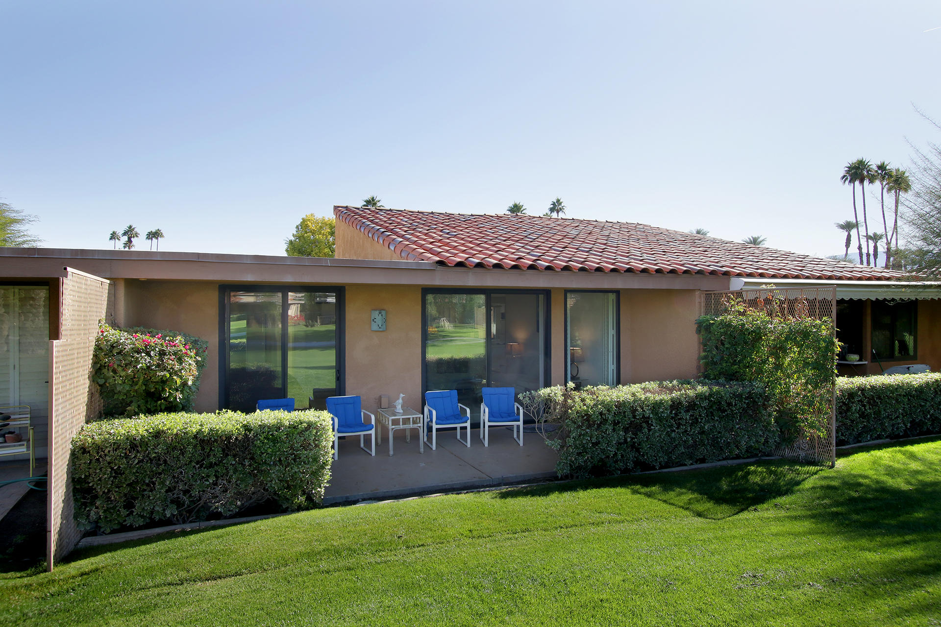 6 Cadiz Drive Rancho Mirage, CA 92270 - Photo 5 of 27 a front view of a house with garden and porch