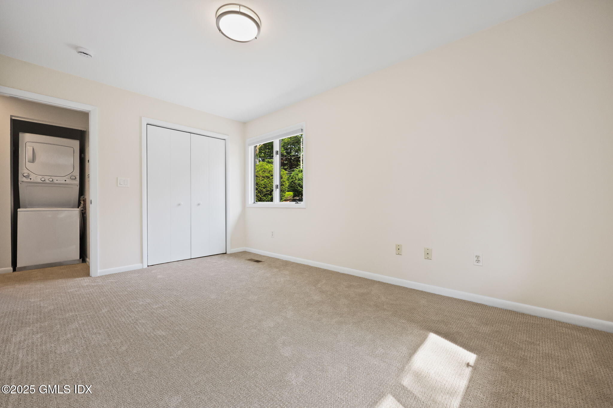 11 Maple Avenue, Unit 202 Greenwich, CT 06830 - Photo 13 of 18 an empty room with windows and closet