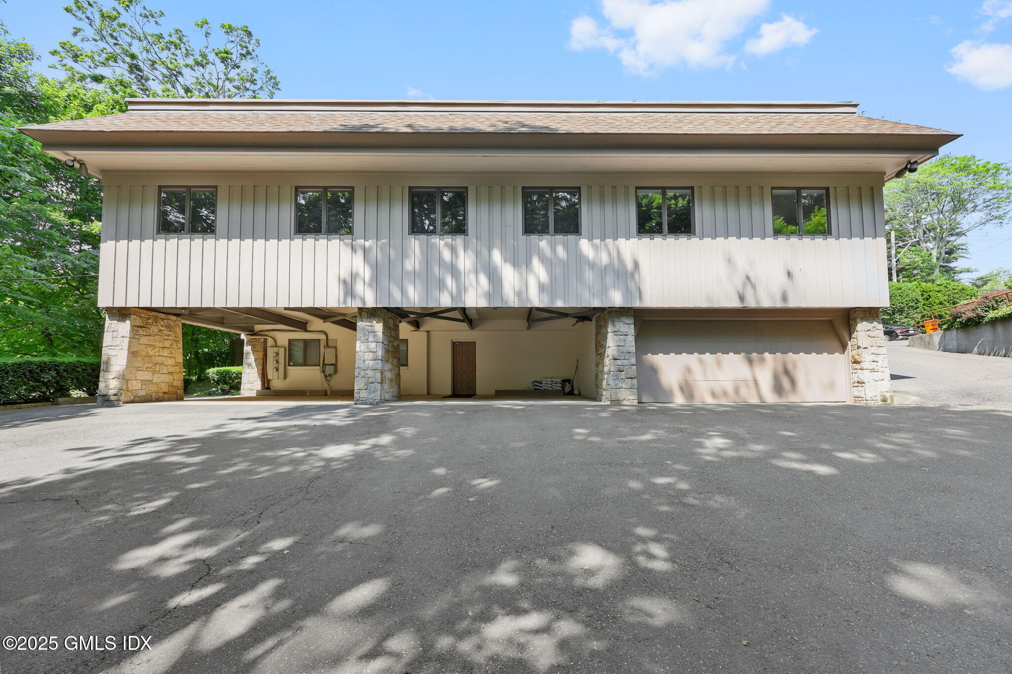 11 Maple Avenue, Unit 202 Greenwich, CT 06830 - Photo 16 of 18 a front view of a house with yard