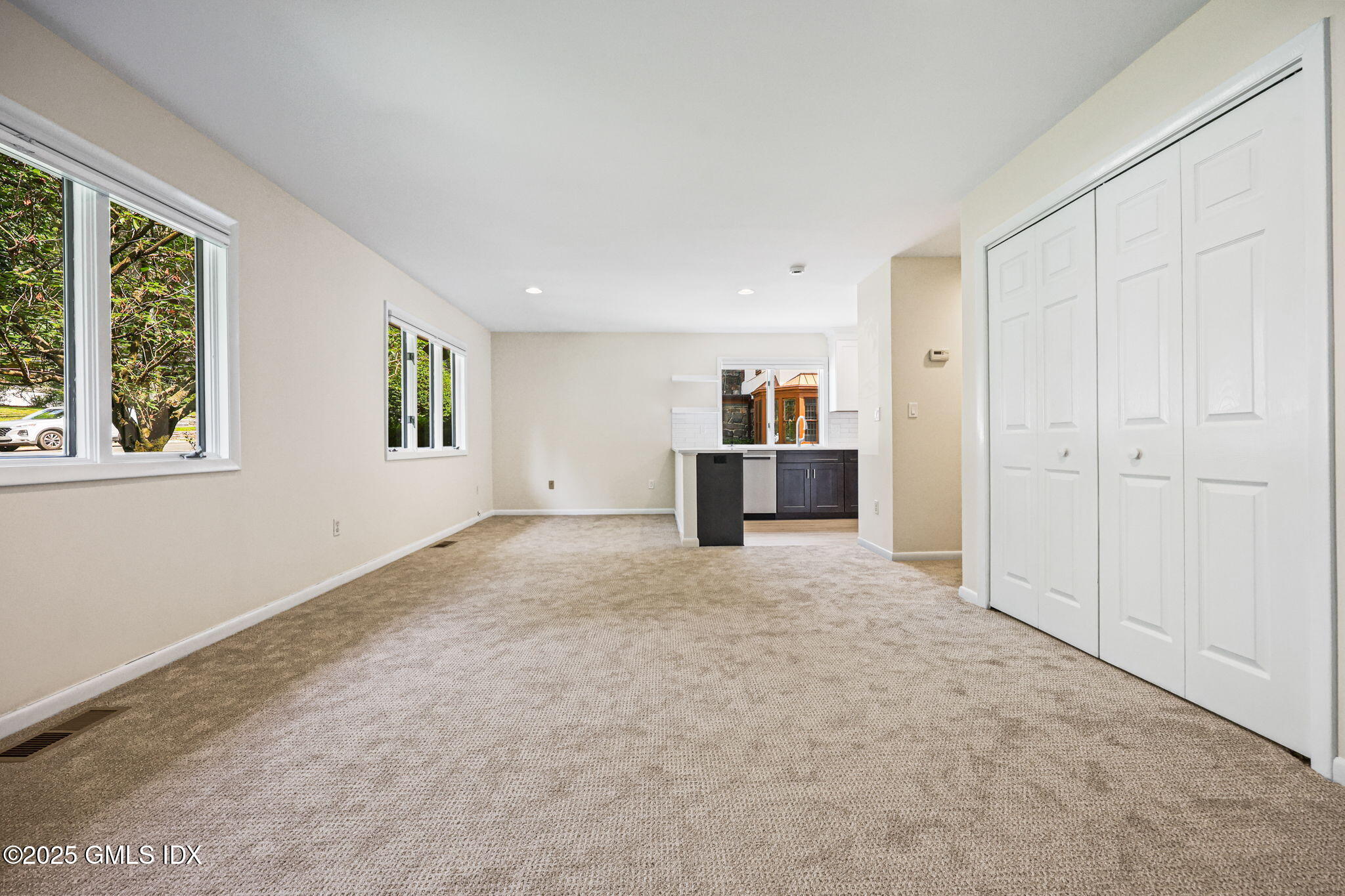 11 Maple Avenue, Unit 202 Greenwich, CT 06830 - Photo 3 of 18 an empty room with windows and pillars in it