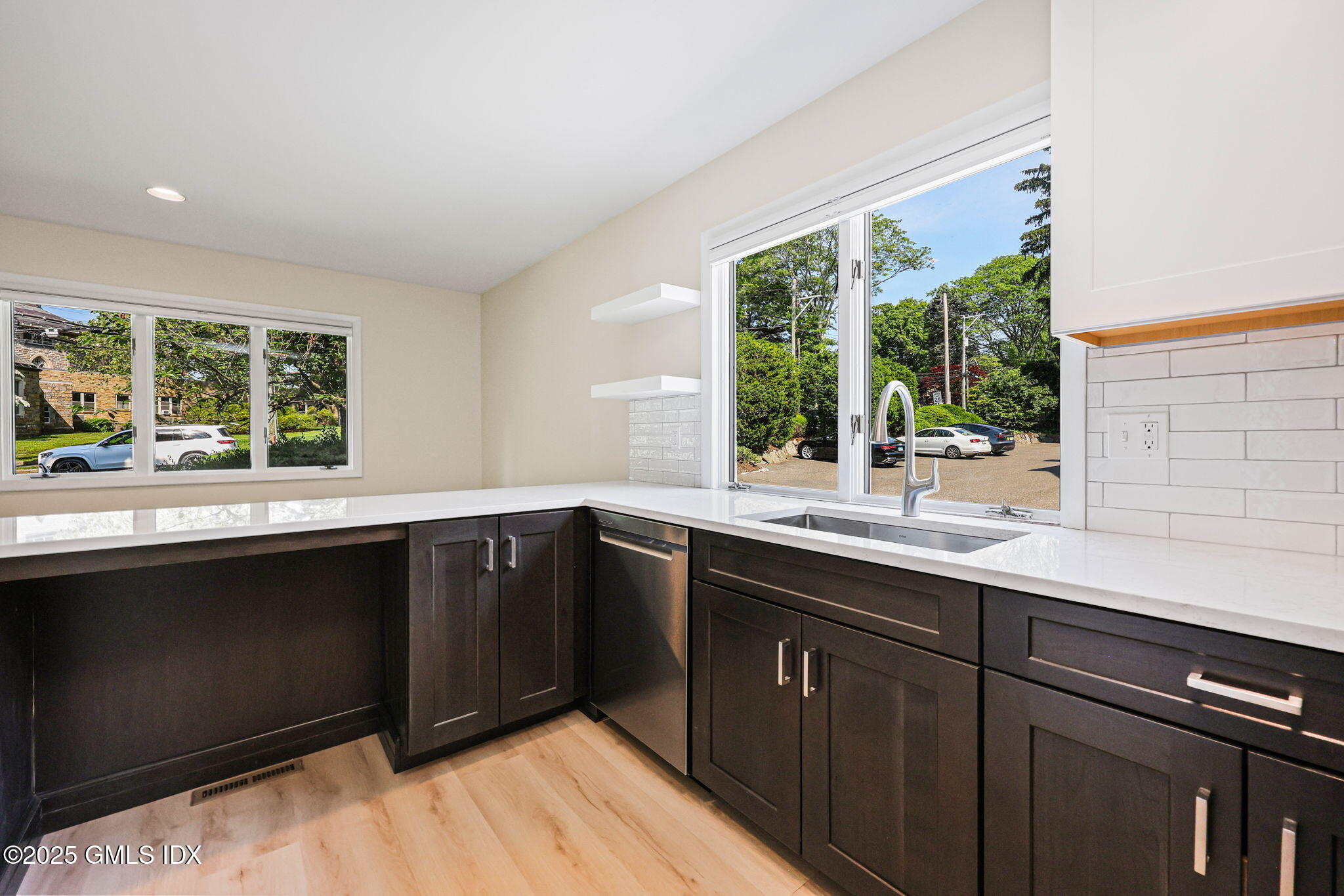 11 Maple Avenue, Unit 202 Greenwich, CT 06830 - Photo 8 of 18 a kitchen with a sink and large window