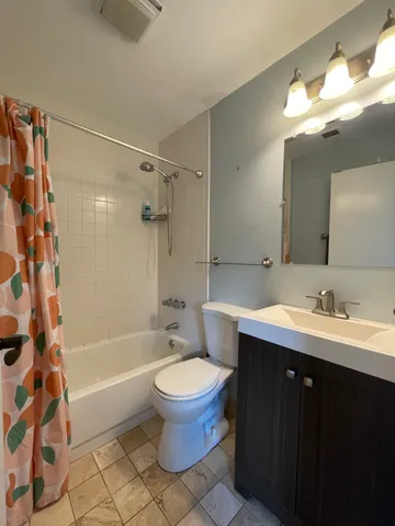 a bathroom with a sink toilet a shower and a mirror