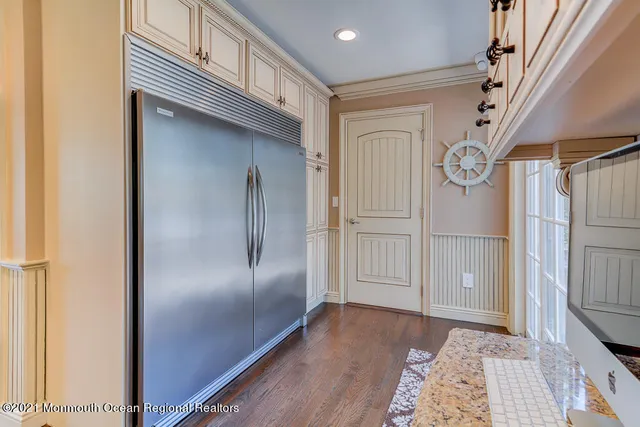 a view of hallway with wooden floor
