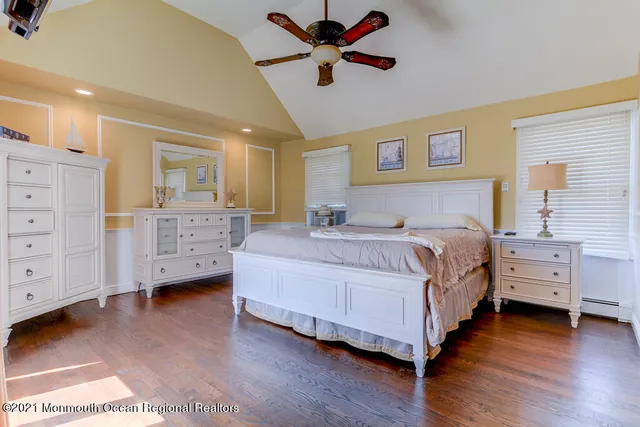 a bedroom with a bed and dresser