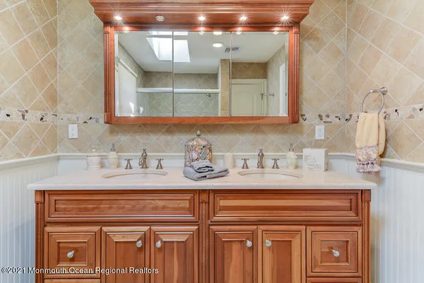 a bathroom with a sink and a mirror