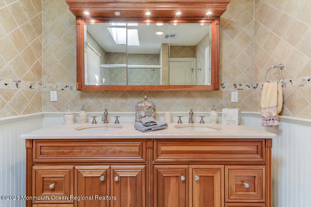a bathroom with a sink and a mirror