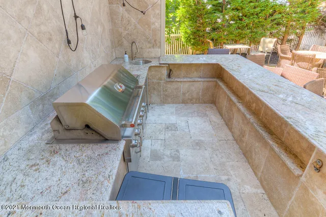a view of a patio with table and chairs