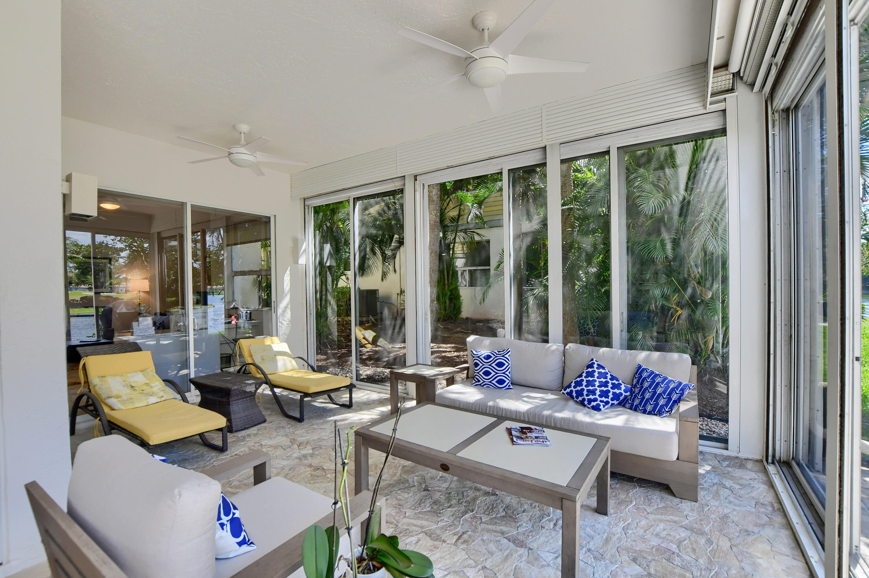 2461 Northwest 59th Street, Unit 701 Boca Raton, FL 33496 - Photo 33 of 62 GLASSED-SCREENED-IN PATIO / LAKE VIEWS