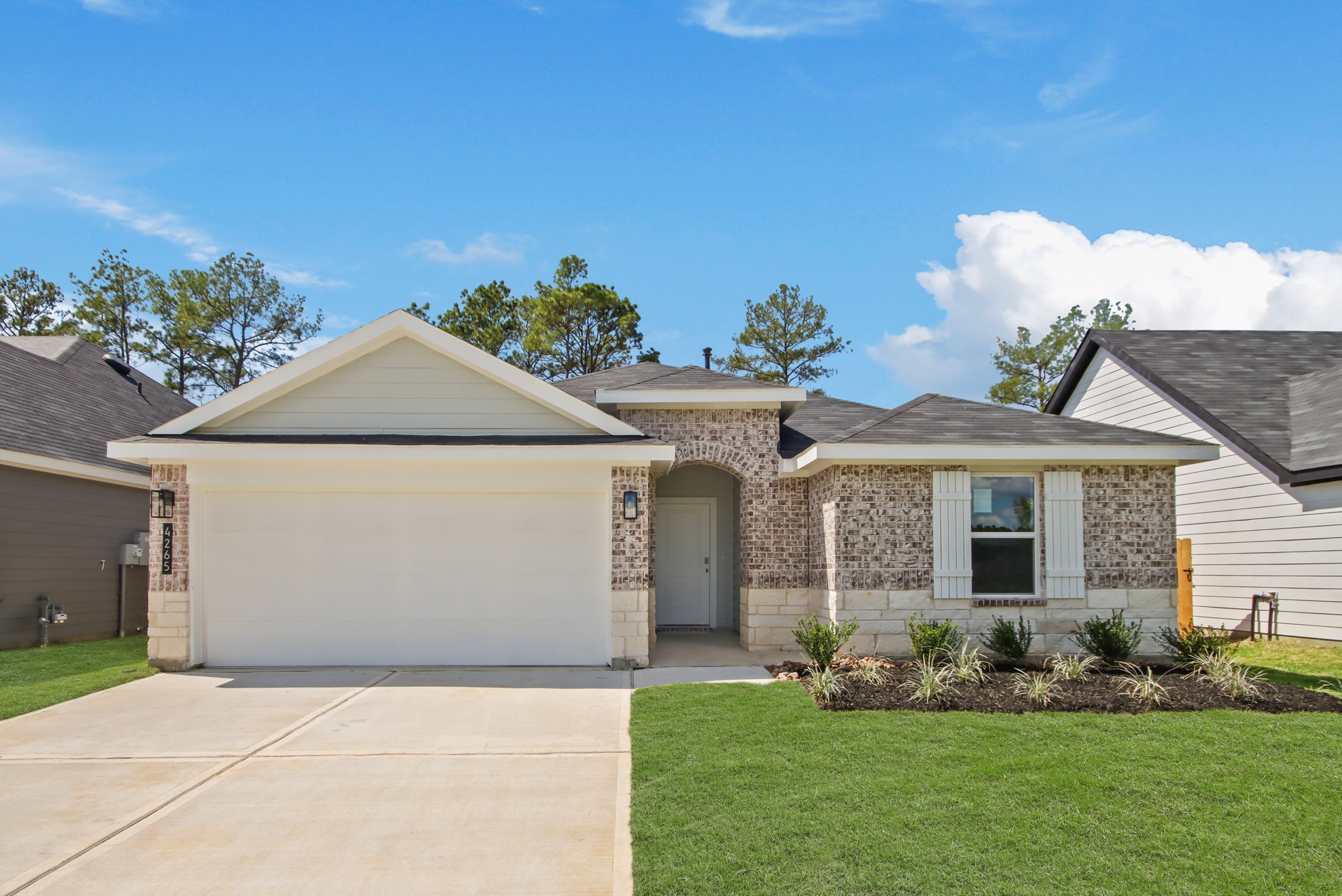 front view of a house with a yard
